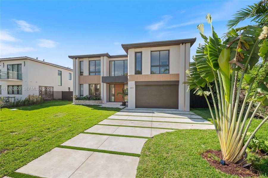 Front exterior of a new home in , Miami, FL, highlighting curb appeal (Image 1). Front exterior of a new home in , Miami, FL, highlighting curb appeal (Image 1).