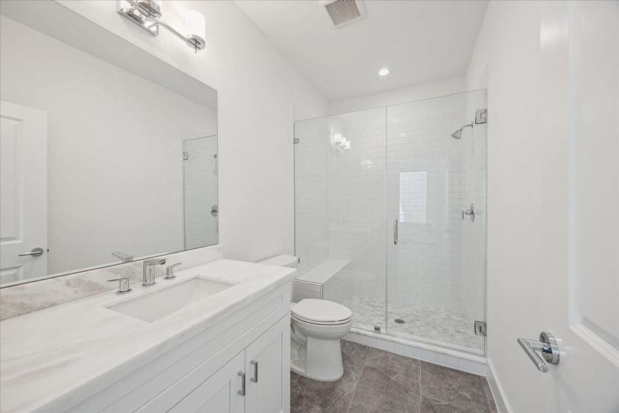 En-Suite Bathroom * Large Shower with Bench Seating and Subway Tile. En-Suite Bathroom * Large Shower with Bench Seating and Subway Tile.