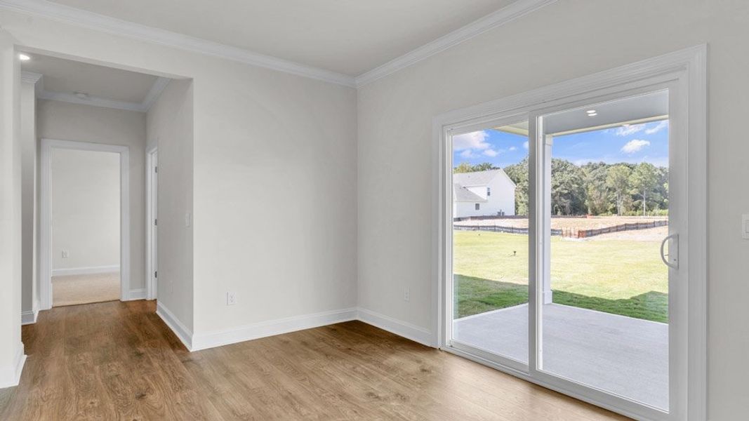 Representative unfurnished interior of a home built from the NORMAN by D.R. Horton in Eagle Creek, Fuquay Varina (Image 12).