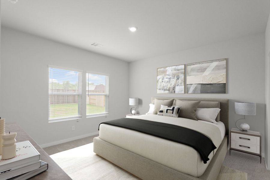 A bedroom with a large window.