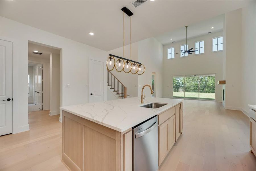 Kitchen featuring light brown cabinetry, light wood-style floors, dishwasher, a ceiling fan, and recessed lighting Kitchen featuring light brown cabinetry, light wood-style floors, dishwasher, a ceiling fan, and recessed lighting