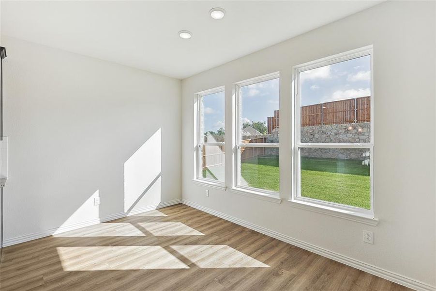 Spare room with light wood-type flooring