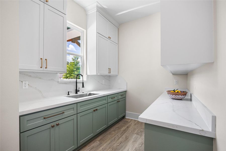 This Walk-In Butler's Pantry has it all with Opening Shelving and Plenty of Storage to Store Everything You Need for Week Night Meals or Entertaining Guests.
