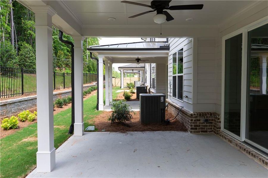 Exterior details and patio area of a home in Millcroft Townhomes, Buford (Image 2).