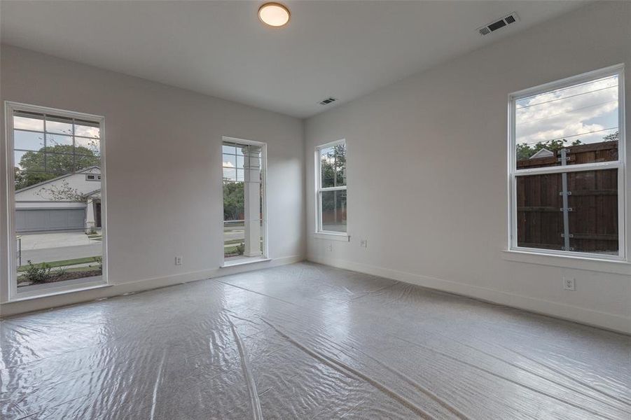 Spare room featuring plenty of natural light