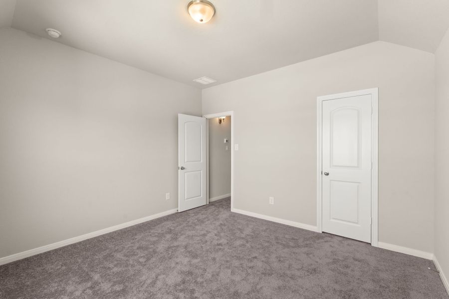 An additional view of the second bedroom with a walk in closet.