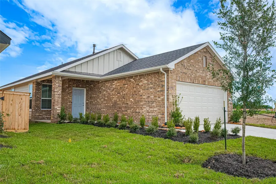 Front exterior of a new home in La Segarra, Brookshire, TX, highlighting curb appeal (Image 1).