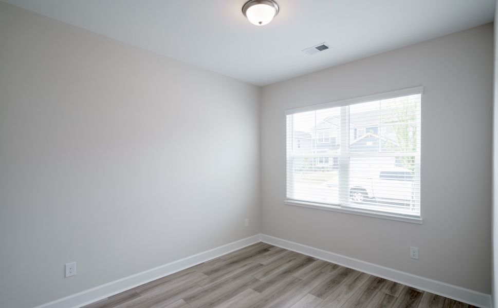 Representative unfurnished interior of a home built from the The Holland by Cothran Homes in Holly Ridge, Greenville (Image 28).