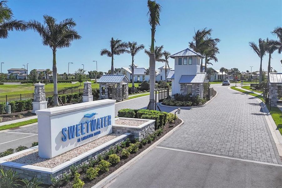 Front exterior of a new home in Sweetwater at Lakewood Ranch, Bradenton, FL, highlighting curb appeal (Image 26).