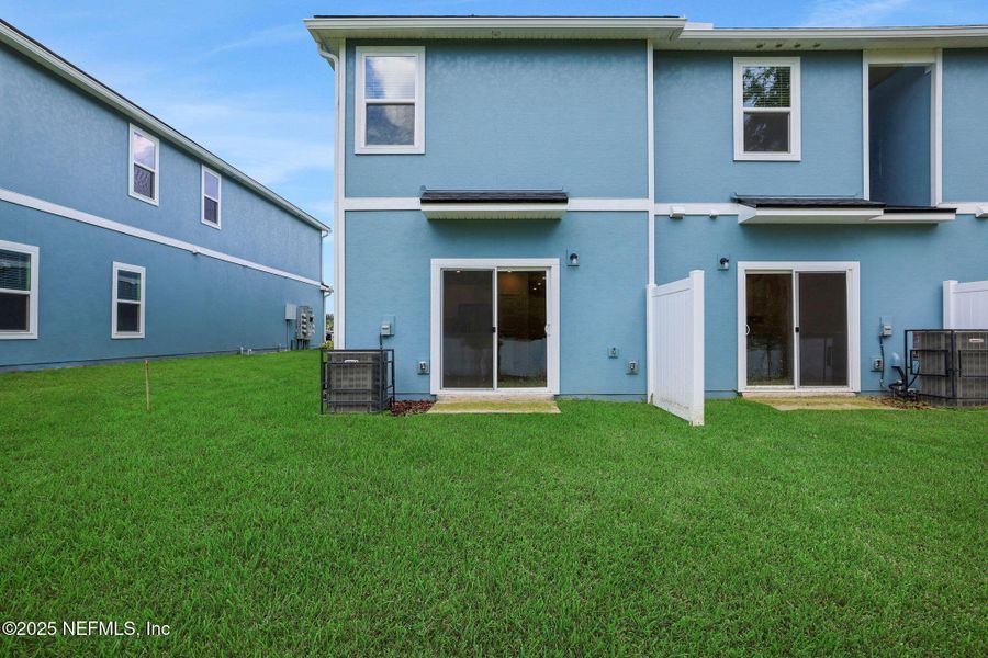 Front exterior of a new home in Kasen Oaks, Jacksonville, FL, highlighting curb appeal (Image 23).