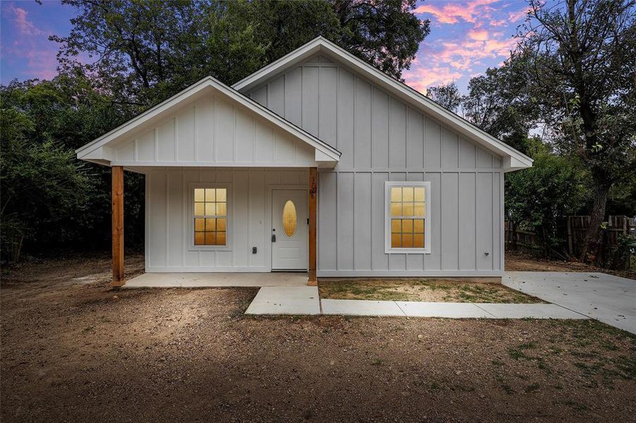 Modern farmhouse with board and batten siding and a porch