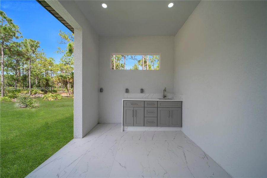 Exterior details and patio area of a home in , Lehigh Acres (Image 4). Exterior details and patio area of a home in , Lehigh Acres (Image 4).