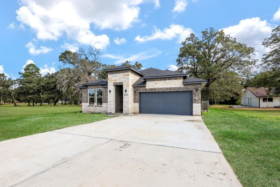 Front exterior of a new home in , Livingston, TX, highlighting curb appeal (Image 18). Front exterior of a new home in , Livingston, TX, highlighting curb appeal (Image 18).