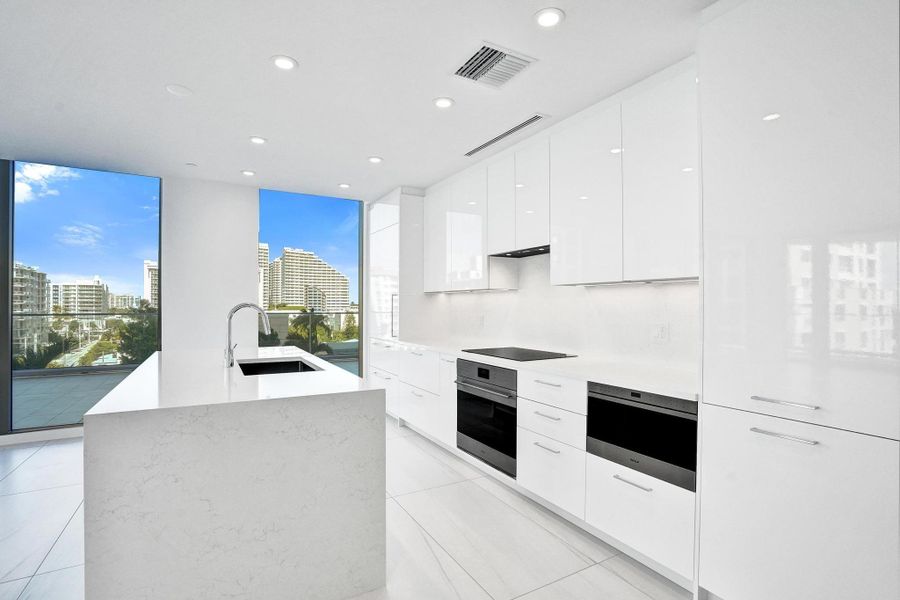 Light and bright gourmet kitchen features high end appliances and gorgeous views. Light and bright gourmet kitchen features high end appliances and gorgeous views.