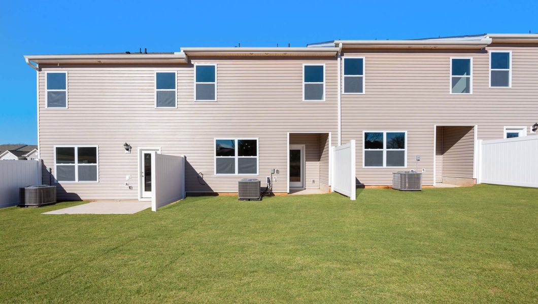 Exterior details and patio area of a home in Brookside Ridge Townhomes, Greer (Image 3).