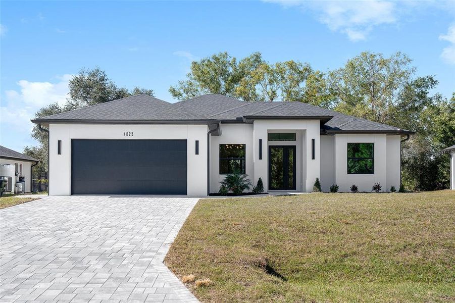 Front exterior of a new home in , North Port, FL, highlighting curb appeal (Image 1). Front exterior of a new home in , North Port, FL, highlighting curb appeal (Image 1).