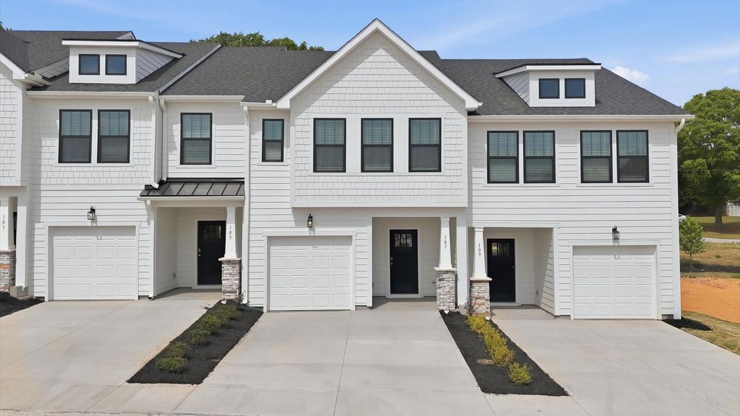 Front exterior of a new home in Gresham Station, Simpsonville, SC, highlighting curb appeal (Image 1). Front exterior of a new home in Gresham Station, Simpsonville, SC, highlighting curb appeal (Image 1).