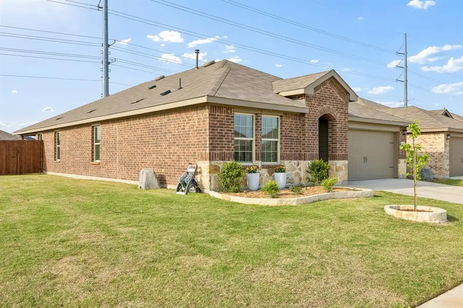 View of front of home with brick siding, an attached garage, concrete driveway, and a shingled roof View of front of home with brick siding, an attached garage, concrete driveway, and a shingled roof