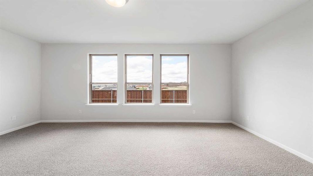 Unfurnished room with carpet