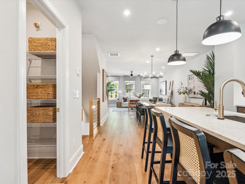 Large Pantry Seamlessly Connected to Kitchen. *Model Photos | Actual Finishes, Structural Selections, and Orientation May Vary. Large Pantry Seamlessly Connected to Kitchen. *Model Photos | Actual Finishes, Structural Selections, and Orientation May Vary.