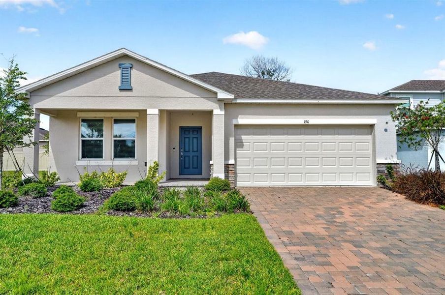 Front exterior of a new home in Riverfront, Edgewater, FL, highlighting curb appeal (Image 25). Front exterior of a new home in Riverfront, Edgewater, FL, highlighting curb appeal (Image 25).