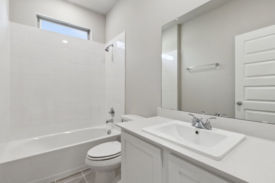 Bathroom in the Claret home plan by Trophy Signature Homes – REPRESENTATIVE PHOTO