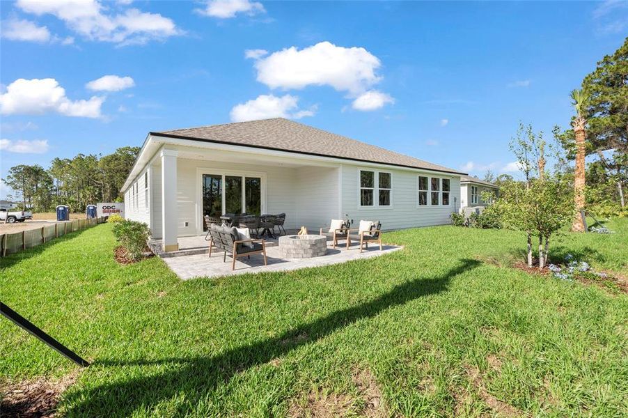 Front exterior of a new home in The Cypress Series at Reserve East, Flagler Beach, FL, highlighting curb appeal (Image 2).
