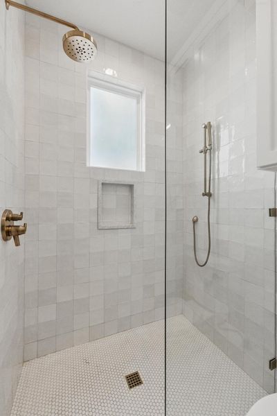 Full bathroom featuring a shower stall Full bathroom featuring a shower stall