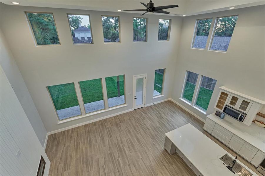 A view of the first floor living area from the second floor.