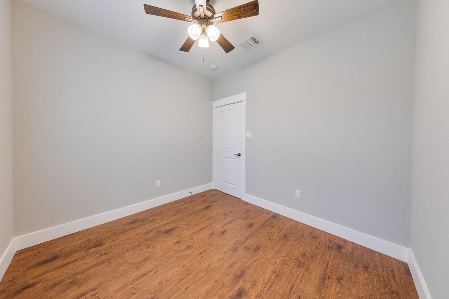 Throughout the home, ceiling fans provide added comfort and a cool breeze, enhancing the living spaces.