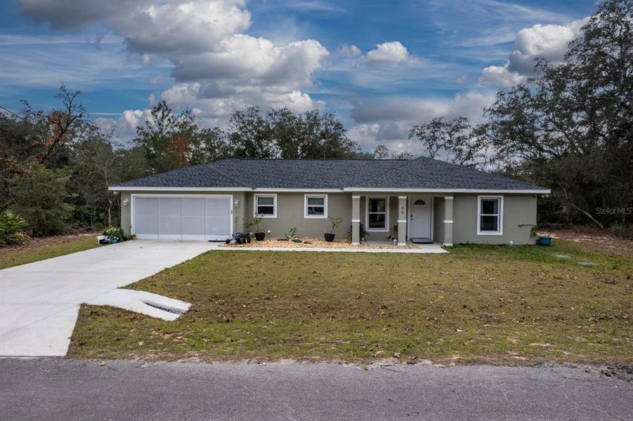 Front exterior of a new home in , Ocklawaha, FL, highlighting curb appeal (Image 19).