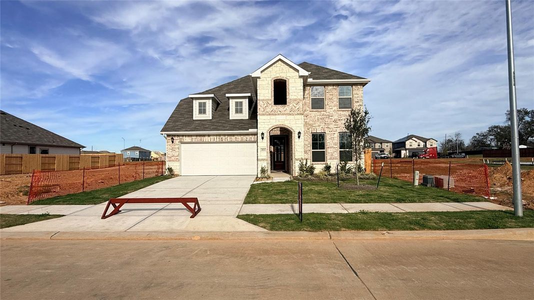 Front exterior of a new home in Colony at Pinehurst, Pinehurst, TX, highlighting curb appeal (Image 1). Front exterior of a new home in Colony at Pinehurst, Pinehurst, TX, highlighting curb appeal (Image 1).