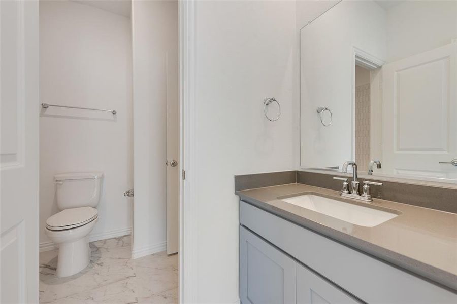 Bathroom with vanity and toilet