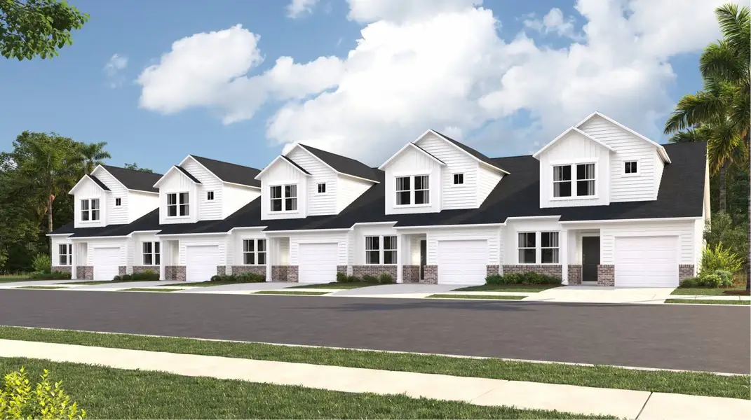 Front exterior of a new home in Brunswick Plantation: Townhomes, Calabash, NC, highlighting curb appeal (Image 1).