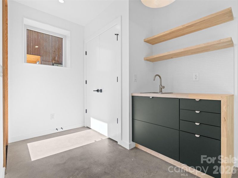 Lower level entry closet & wet bar