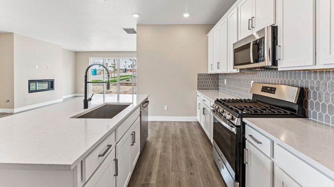 Representative furnished interior of a home built from the Pike by Taylor Morrison in The Aurora Highlands Town Collection, Aurora (Image 18).