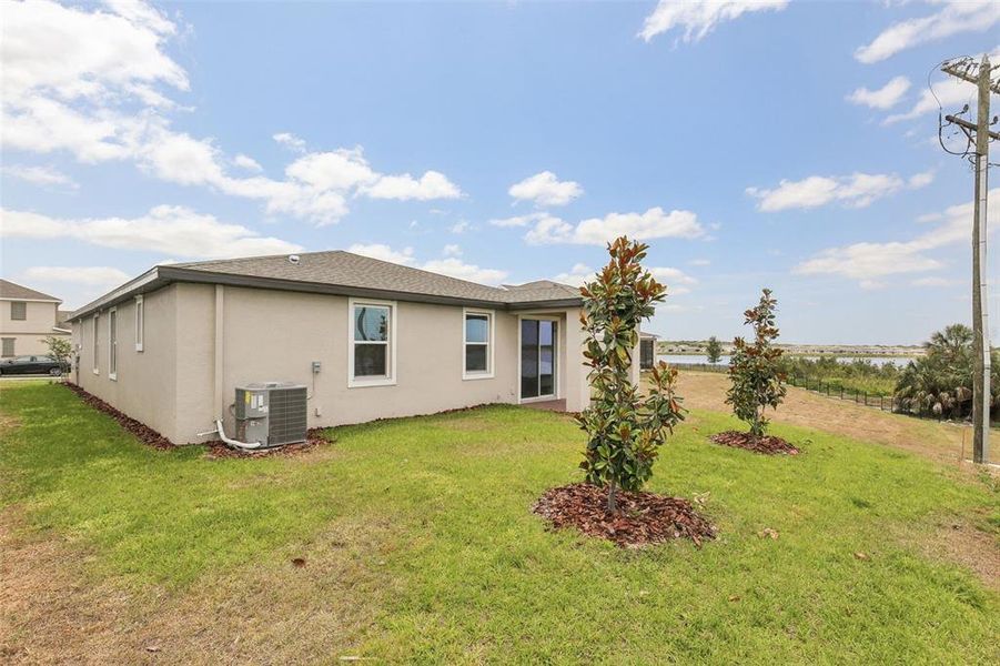 Front exterior of a new home in Eden Hills, Lake Alfred, FL, highlighting curb appeal (Image 18).