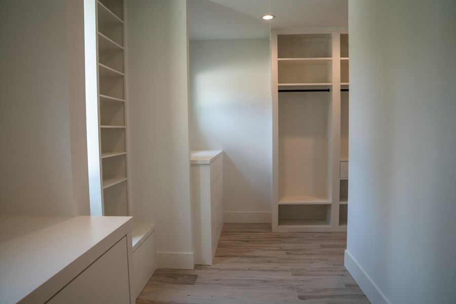 Impressive primary closet, offering an abundance of storage space that is sure to impress.