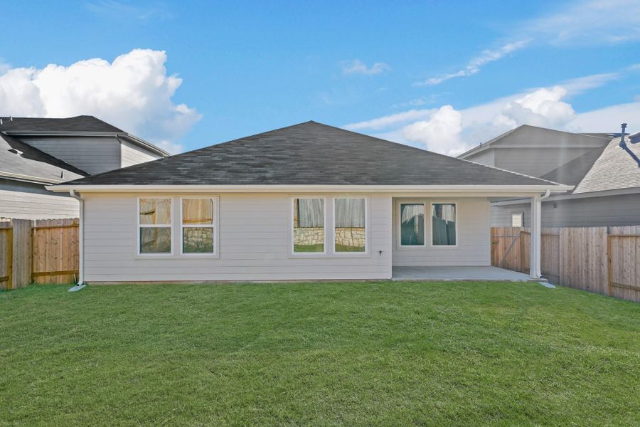Exterior details and patio area of a home in Grand Pines, Magnolia (Image 4). Exterior details and patio area of a home in Grand Pines, Magnolia (Image 4).