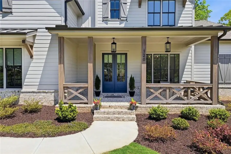 Exterior details and patio area of a home in Malone's Pond, Ball Ground (Image 27).