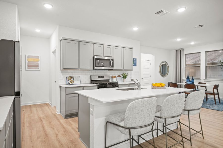 Kitchen in a Trinity Ranch Oak Model home in Elgin TX by Trophy Signature Homes