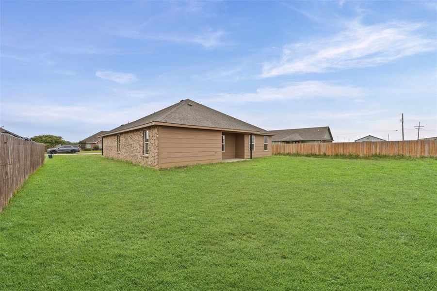 Front exterior of a new home in , Whitney, TX, highlighting curb appeal (Image 16).