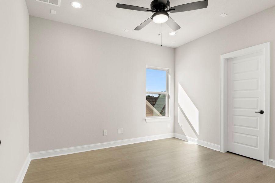 Unfurnished room with recessed lighting, light wood-style floors, and ceiling fan Unfurnished room with recessed lighting, light wood-style floors, and ceiling fan
