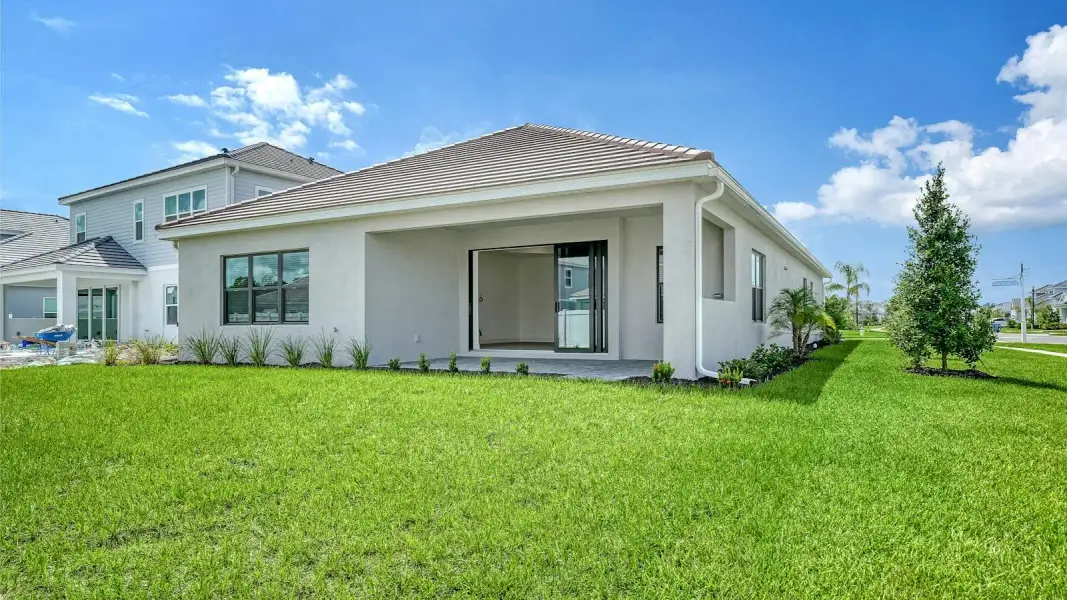 Exterior details and patio area of a home in Windward Real Estate and Homes for Sale in Sarasota, FL - Neal Communities, Lakewood Ranch (Image 3).