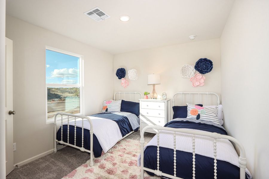 A bedroom with two beds. A bedroom with two beds.