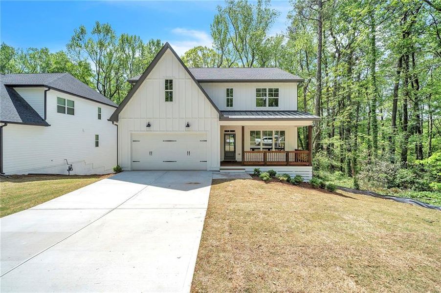 Front exterior of a new home in , Marietta, GA, highlighting curb appeal (Image 1). Front exterior of a new home in , Marietta, GA, highlighting curb appeal (Image 1).