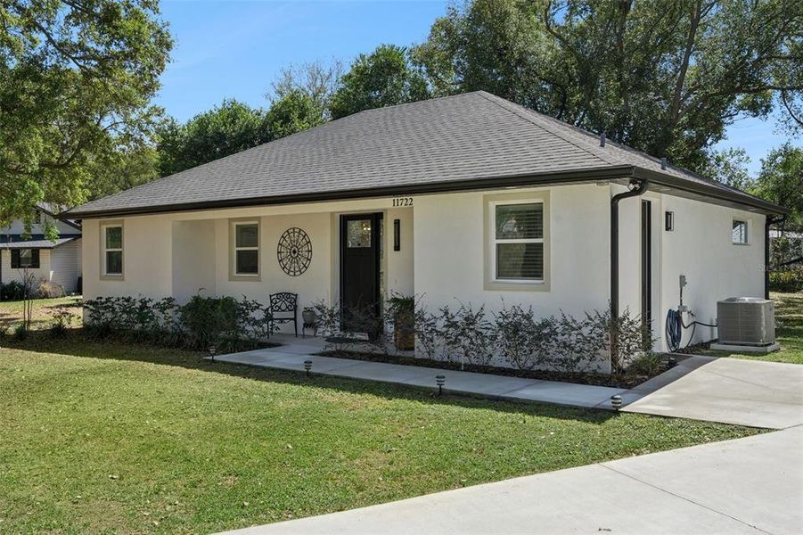 Front exterior of a new home in , Minneola, FL, highlighting curb appeal (Image 25).