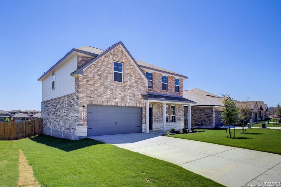 Front exterior of a new home in Comanche Ridge, San Antonio, TX, highlighting curb appeal (Image 41).
