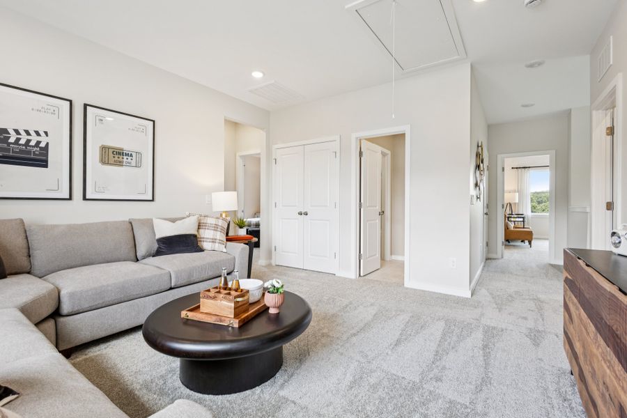 A living room with a couch and a coffee table. A living room with a couch and a coffee table.