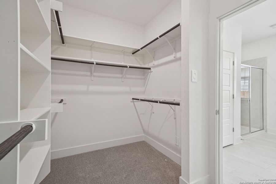 Spacious, unfurnished interior of a new home in Estancia Ranch - Premier Series, San Antonio (Image 22).